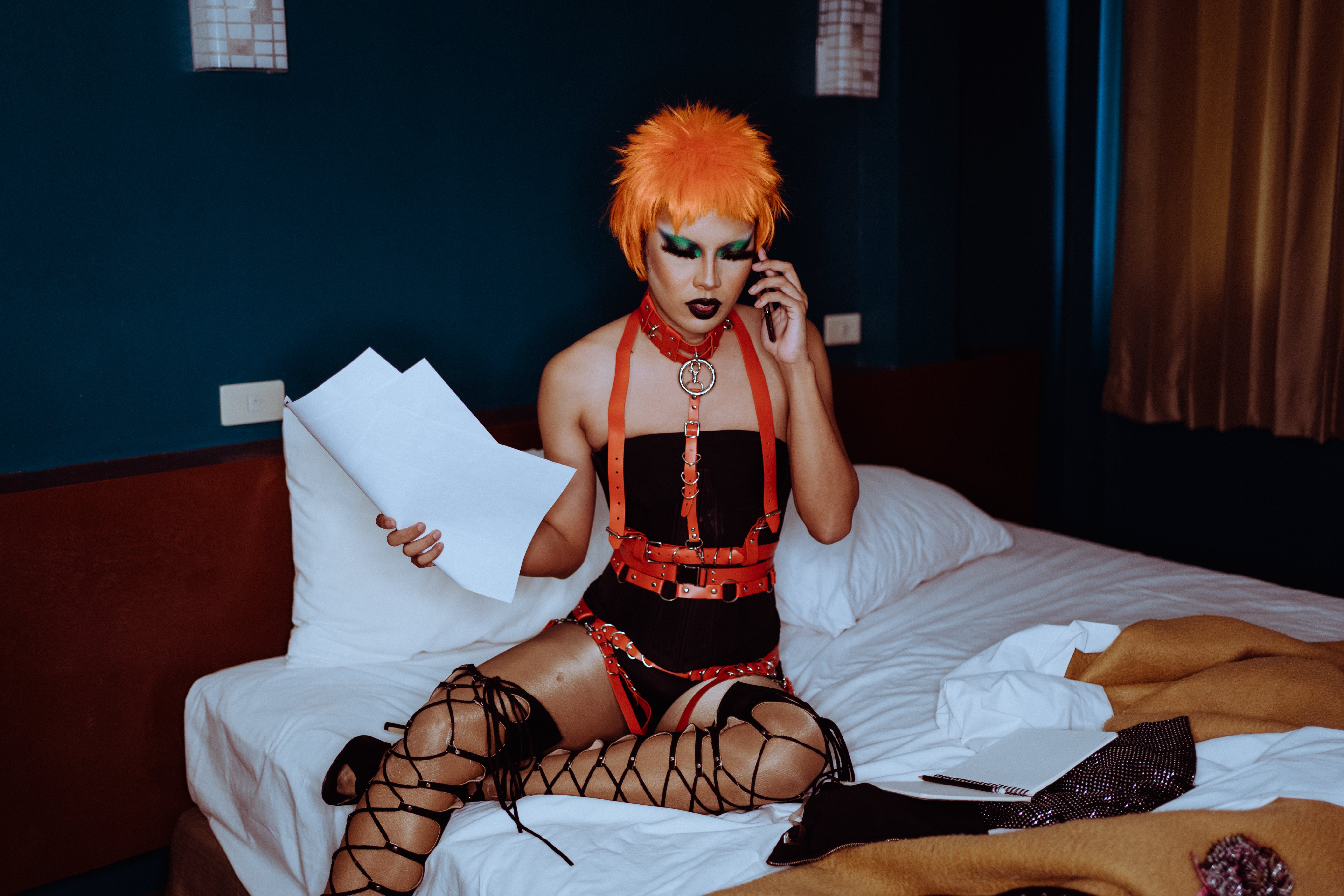 lady wearing orange wig and bondage gear